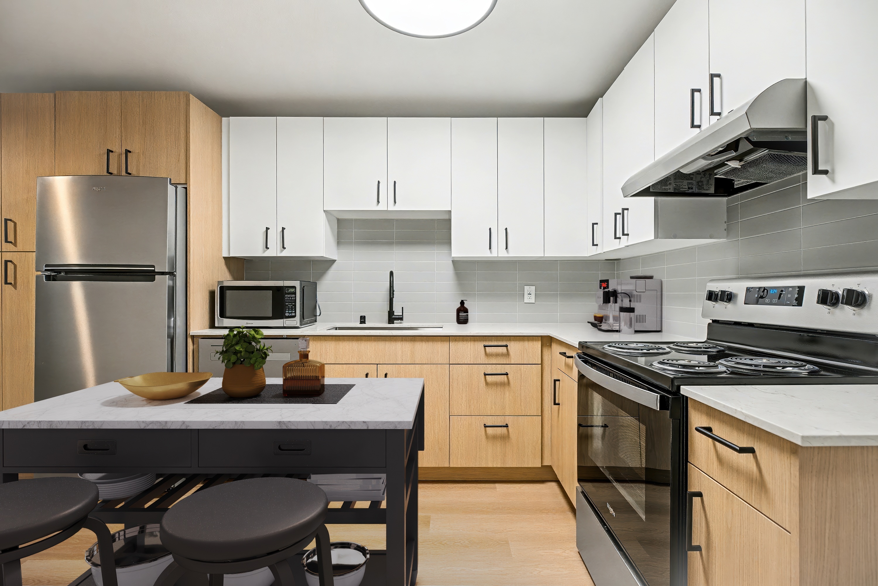 A modern kitchen with wooden cabinets and stainless steel appliances.